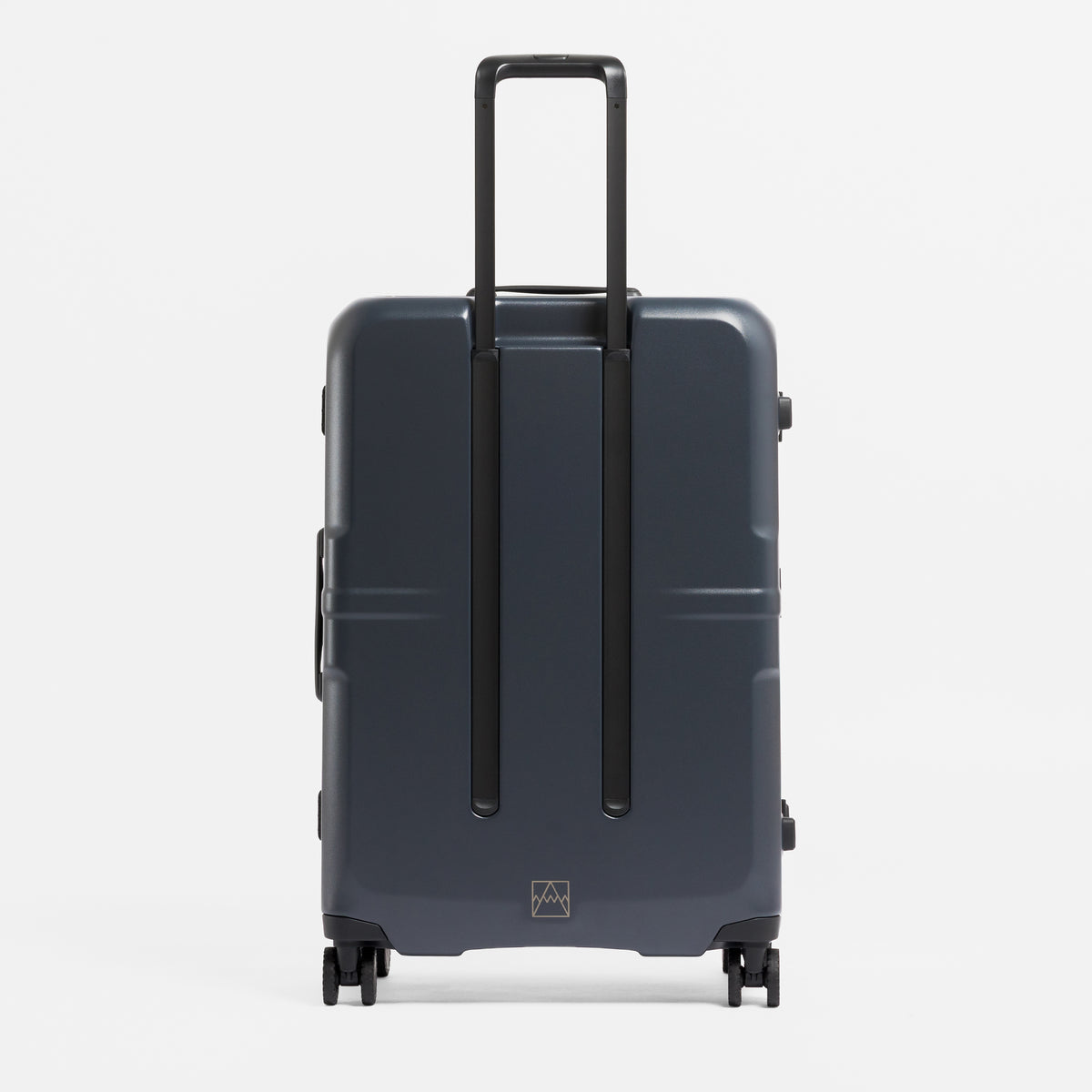A studio shot of the back of the Hardshell Pro 95L in Midnight Blue