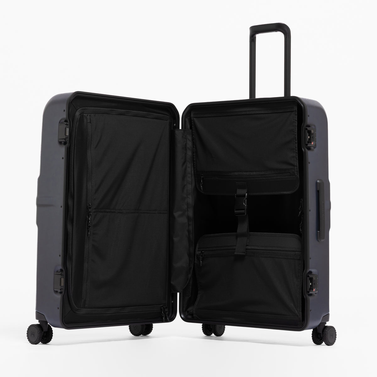 A studio shot of the Hardshell Pro 95L in Midnight Blue standing and open