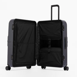 A studio shot of the Hardshell Pro 95L in Midnight Blue standing and open