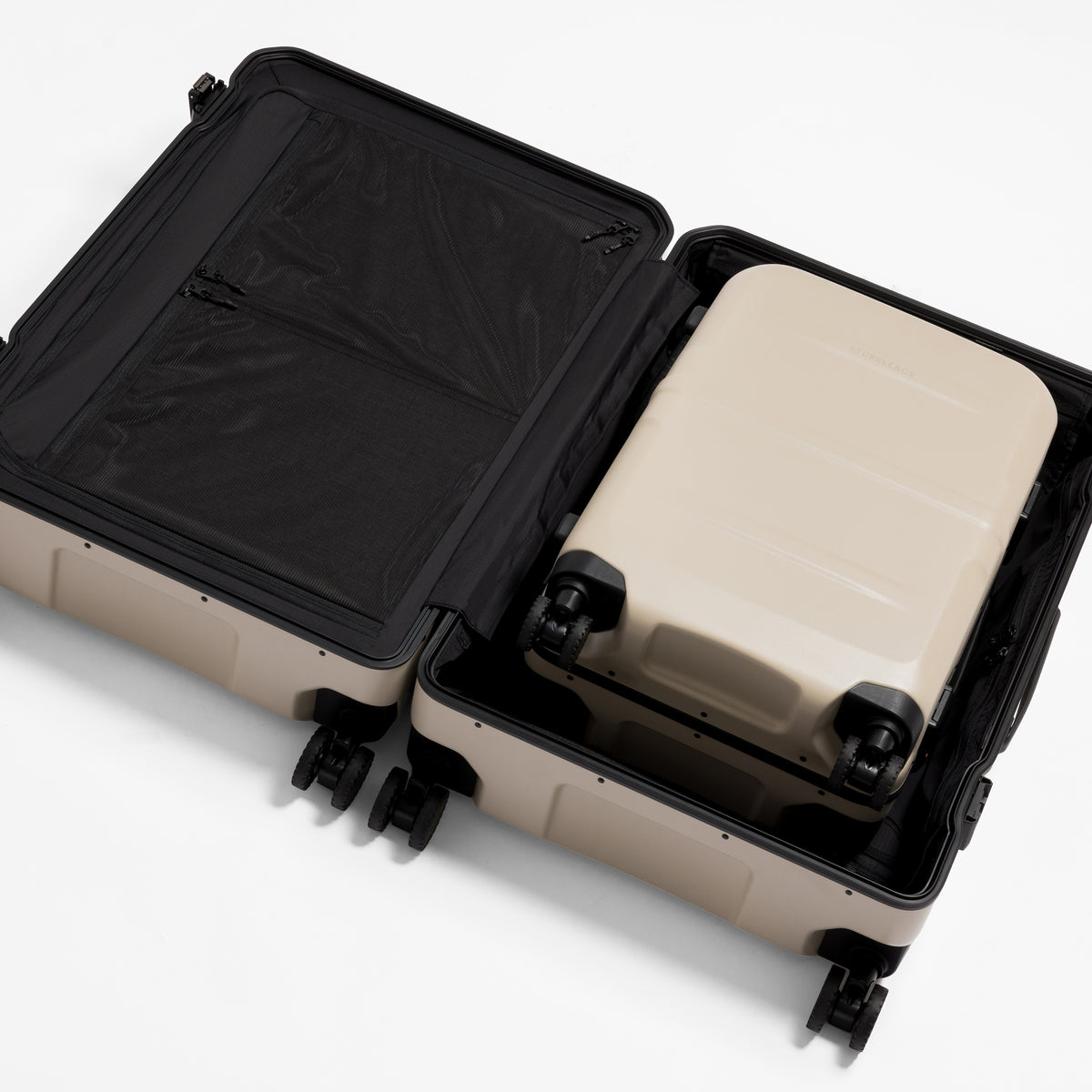 A studio shot of the Hardshell Pro 95L in Sand with a Pro 40L nested inside