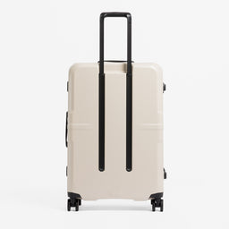 A studio shot of the back of the Hardshell Pro 95L in Sand