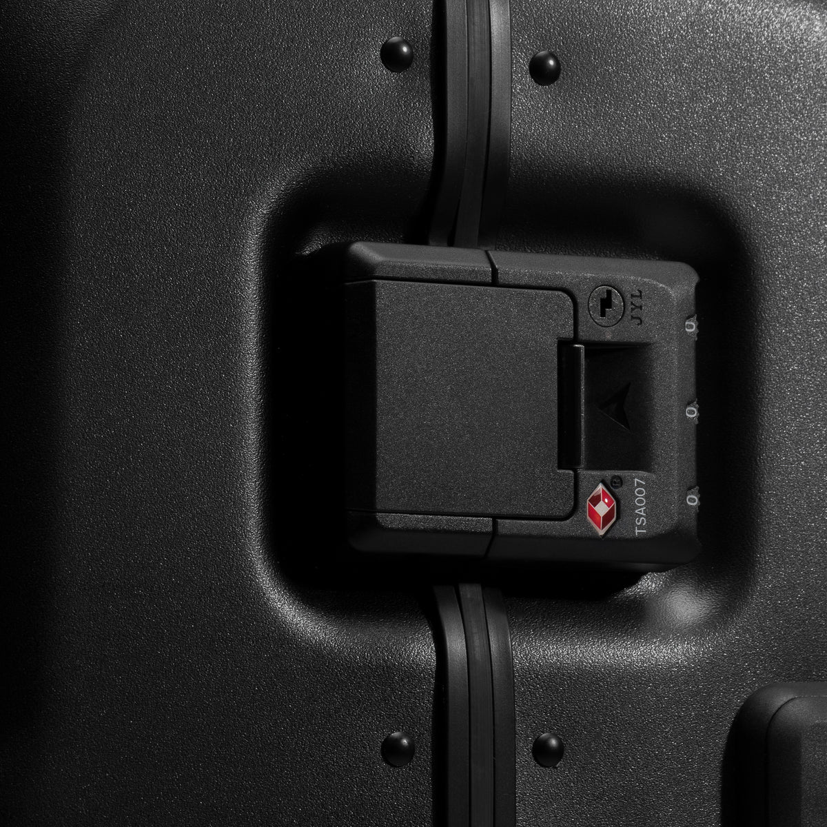 A studio shot of the clip and tsa lock on the Hardshell Pro Trunk 100L in All Black