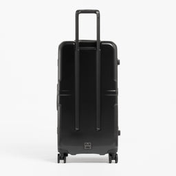 A studio shot of the back of the Hardshell Pro Trunk 100L in All Black