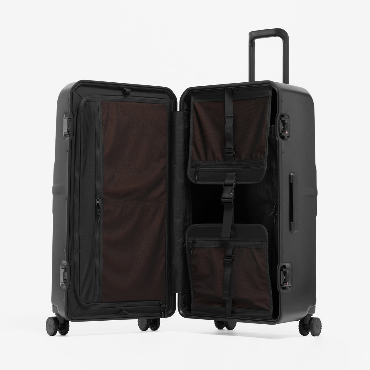 A studio shot of the Hardshell Pro Trunk 100L in All Black standing and open