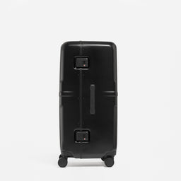 A studio shot of the side and grab handle on the Hardshell Pro Trunk 100L in All Black