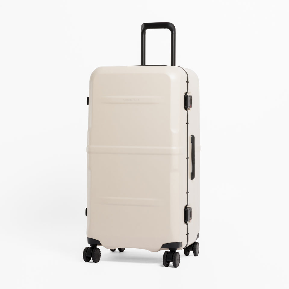 A studio shot of the front of the Hardshell Pro Trunk 100L in Sand
