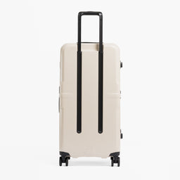 A studio shot of the back of the Hardshell Pro Trunk 100L in Sand