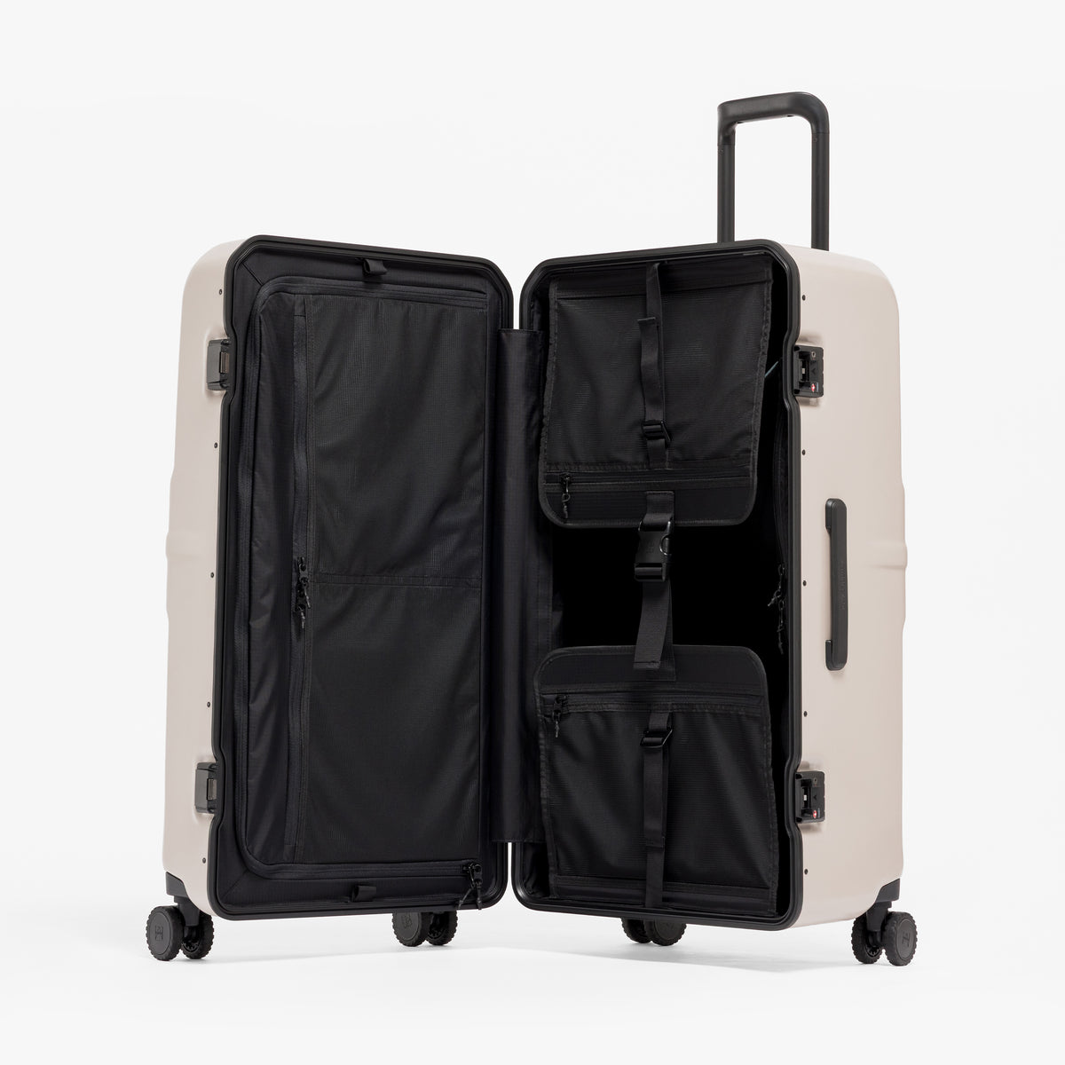A studio shot of the Hardshell Pro Trunk 100L in Sand standing and open