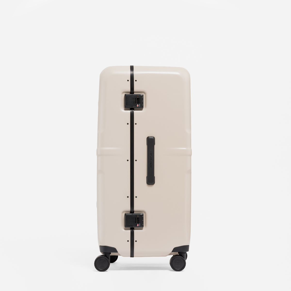 A studio shot of the side and grab handles on the Hardshell Pro Trunk 100L in Sand
