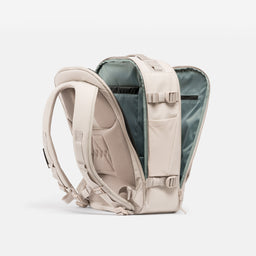 A studio shot of the clam shell opening on the Hybrid Backpack 20L in Tonal Sand