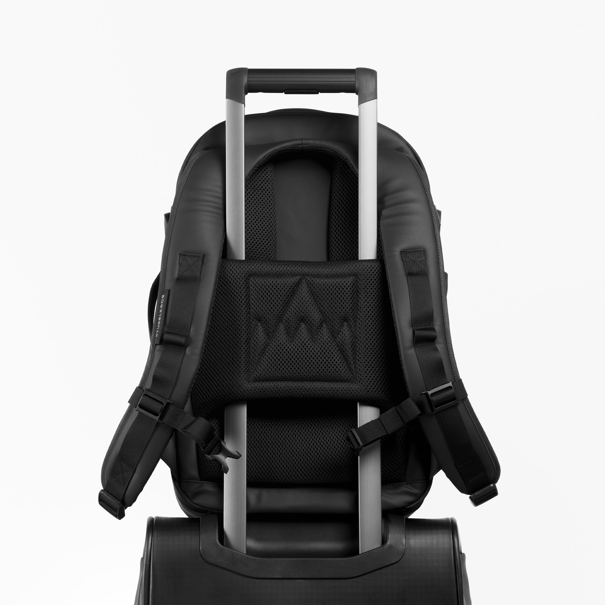 A studio shot of the trolley sleeve on a Hybrid Backpack 20L in All Black