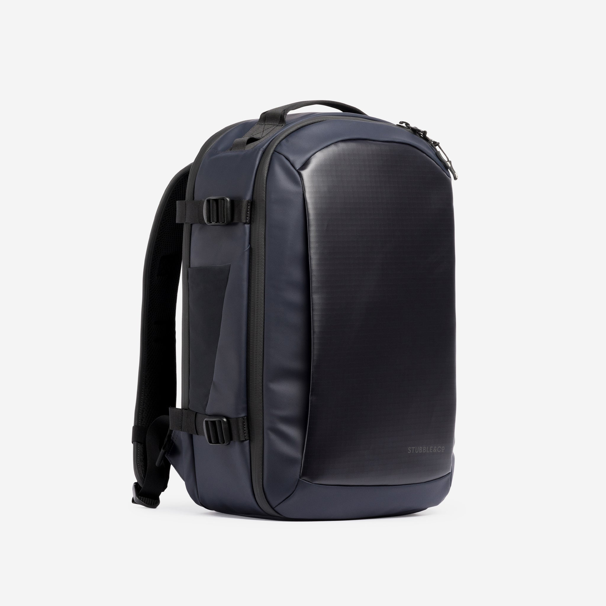 A studio shot of the front and side of a Hybrid Backpack 20L in Midnight Blue