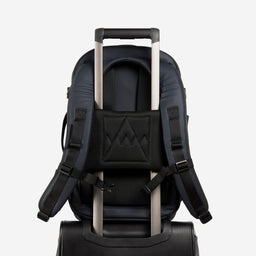 A studio shot of the trolley sleeve on a Hybrid Backpack 20L in Midnight Blue