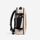 A studio shot of the side bottle pocket on the Hybrid Backpack 20L in Sand