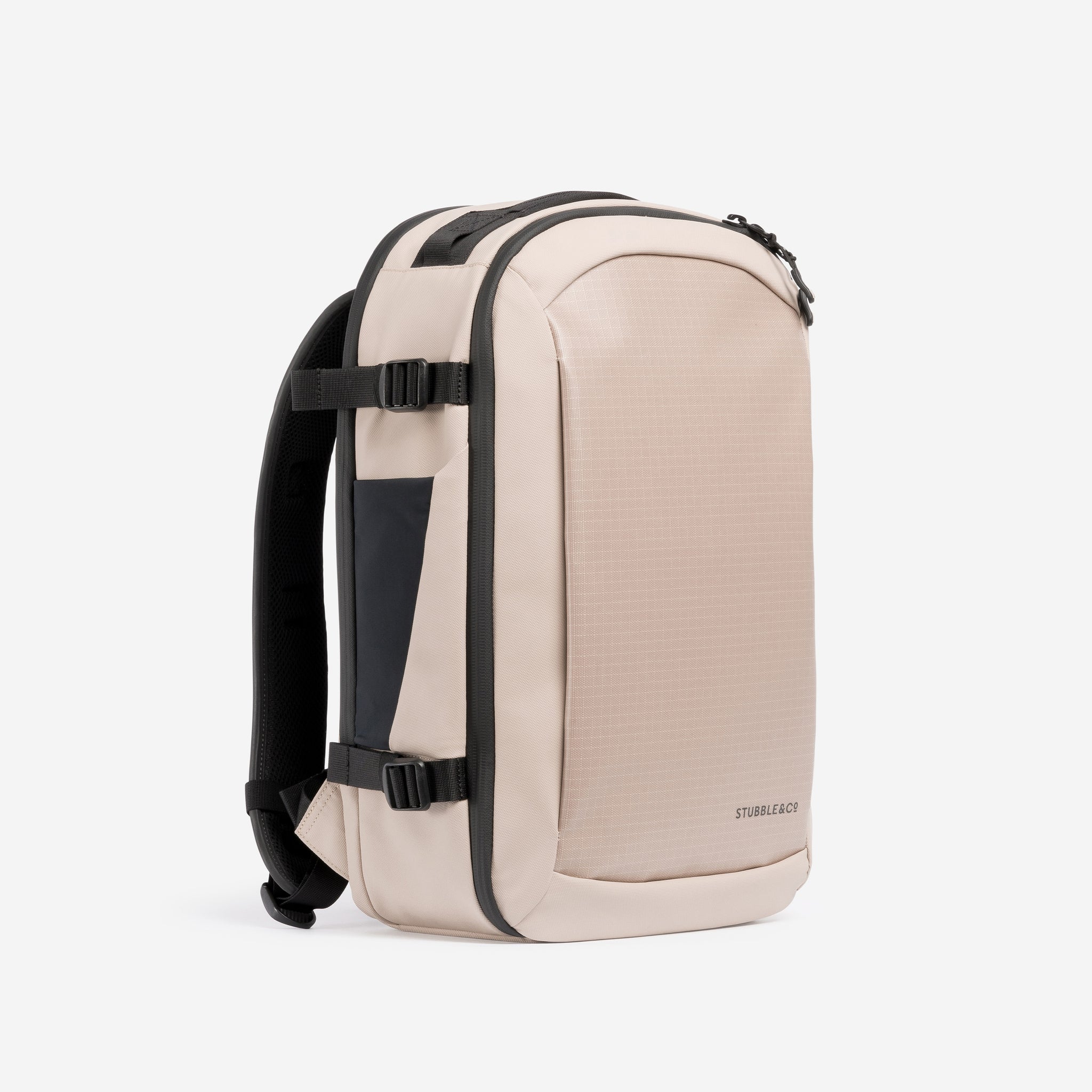 A studio shot of the front and side of the Hybrid Backpack 20L in Sand