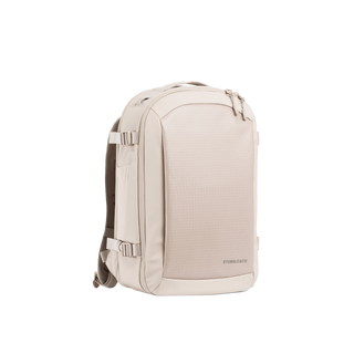 A studio shot of the front and side of an hybrid backpack 20l as cut out transparent PNG- tonal sand