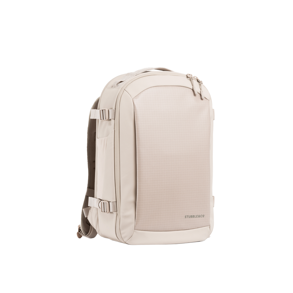 A studio shot of the front and side of an hybrid backpack 20l as cut out transparent PNG- tonal sand