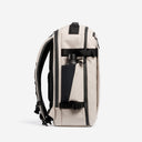 A studio shot of the side bottle pocket on the Hybrid Backpack 30L in Sand