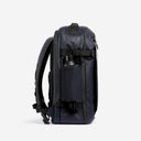 A studio shot of the bottle pocket on the Hybrid Backpack 30L in Midnight Blue