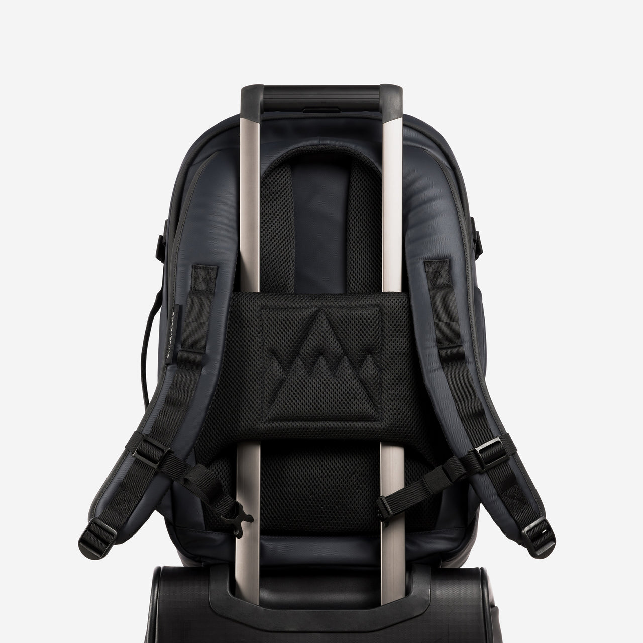 A studio shot of the lugggage sleeve on the Hybrid Backpack 30L in Midnight Blue