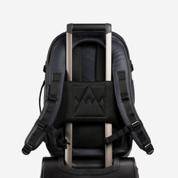 A studio shot of the lugggage sleeve on the Hybrid Backpack 30L in Midnight Blue