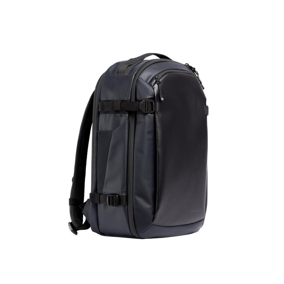 A studio shot of the front and side of a hybrid backpack 30l as cut out transparent PNG-  midnight blue