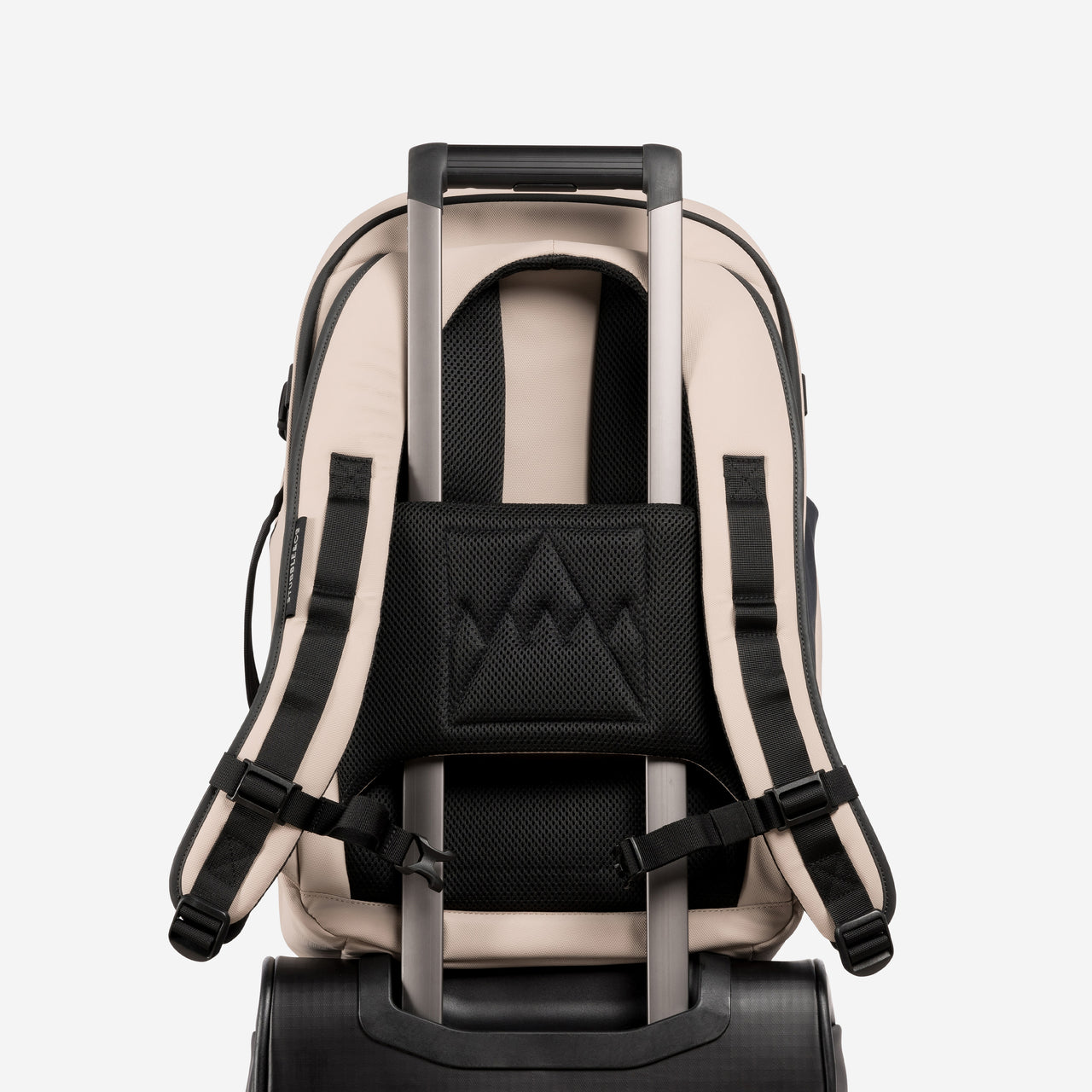 A studio shot of the trolley sleeve on the Hybrid Backpack 30L in Sand