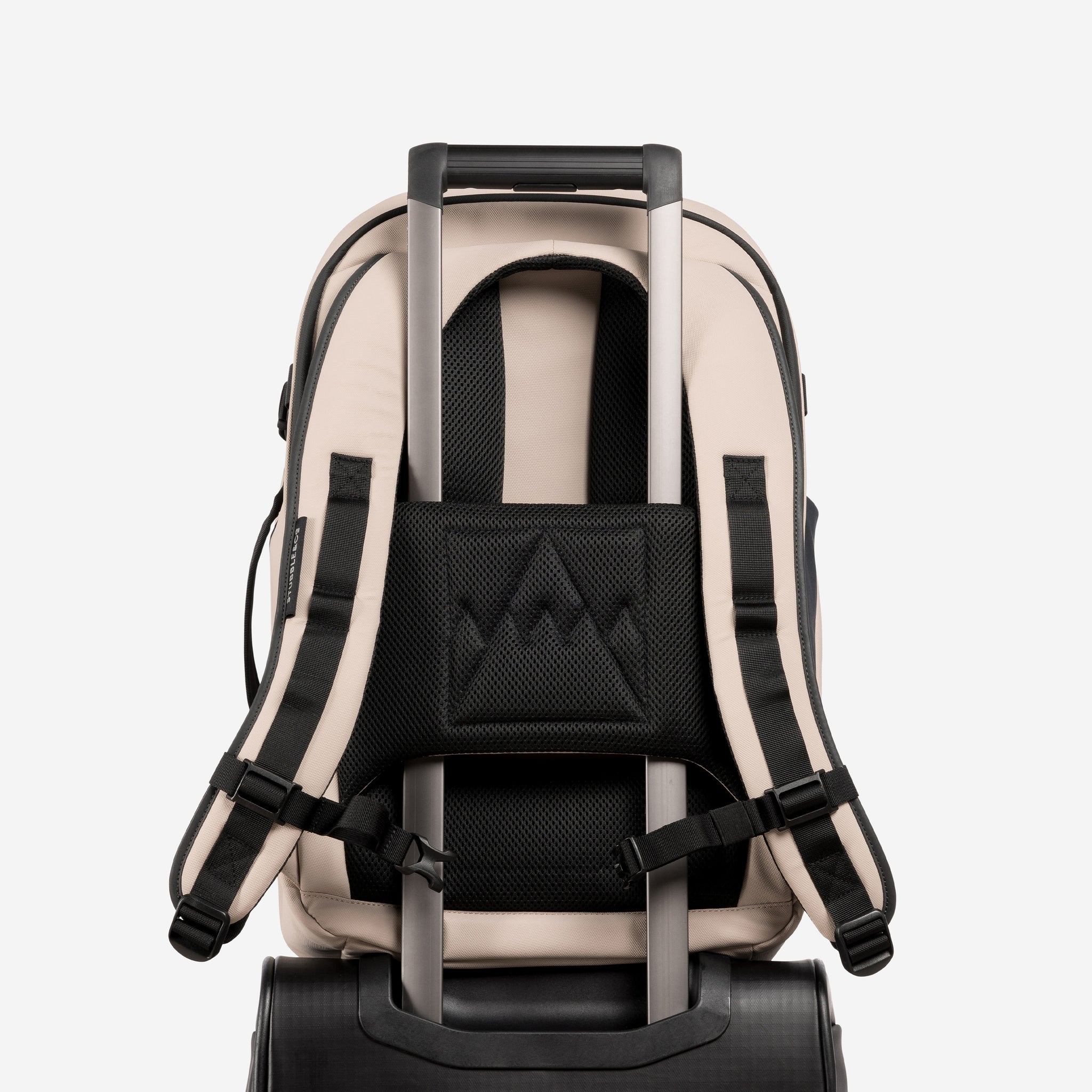 A studio shot of the trolley sleeve on the Hybrid Backpack 30L in Sand