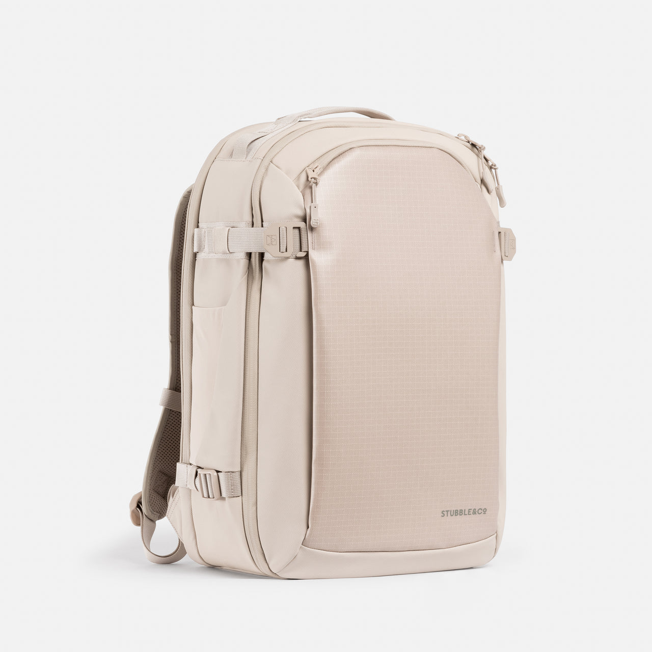 A studio shot of the front and side of the Hybrid Backpack 30L in Tonal Sand