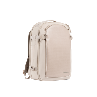 A studio shot of the front and side of a hybrid backpack 30l as cut out transparent PNG-  tonal sand