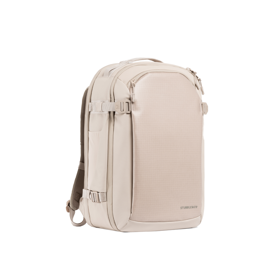 A studio shot of the front and side of a hybrid backpack 30l as cut out transparent PNG-  tonal sand