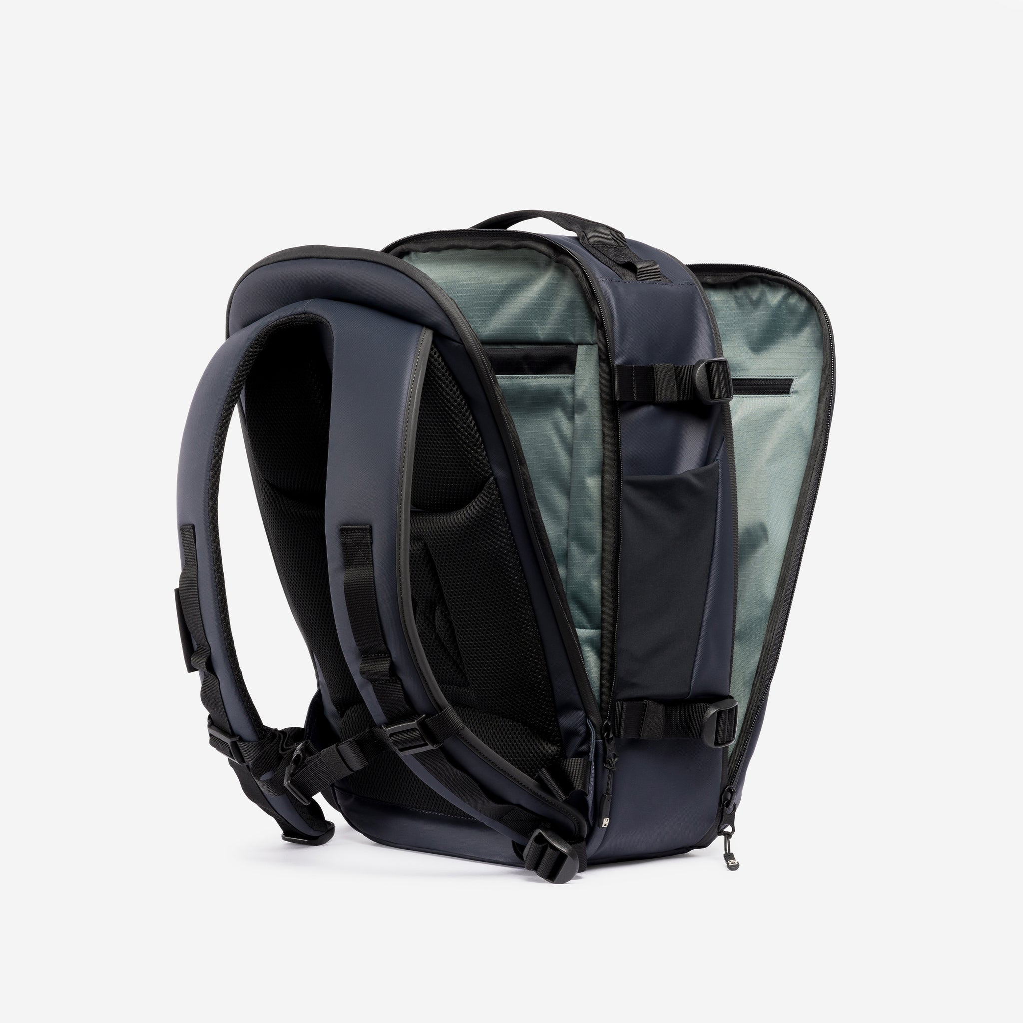 A studio shot of the clam shell opening on the Hybrid Backpack 20L in Midnight Blue