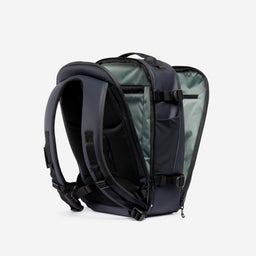 A studio shot of the clam shell opening on the Hybrid Backpack 20L in Midnight Blue