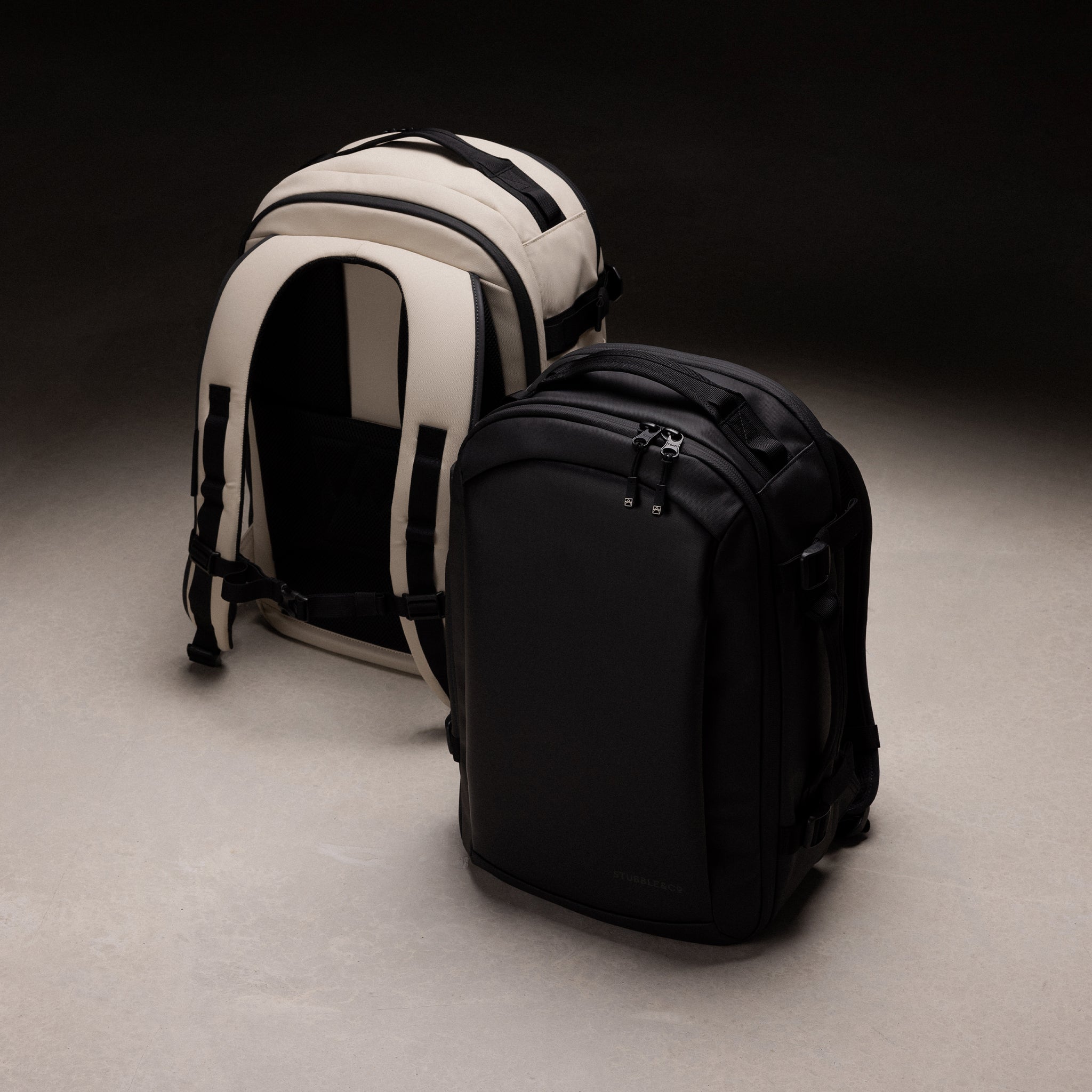 A studio creative of the Hybrid Backpack 20L in sand and All Black