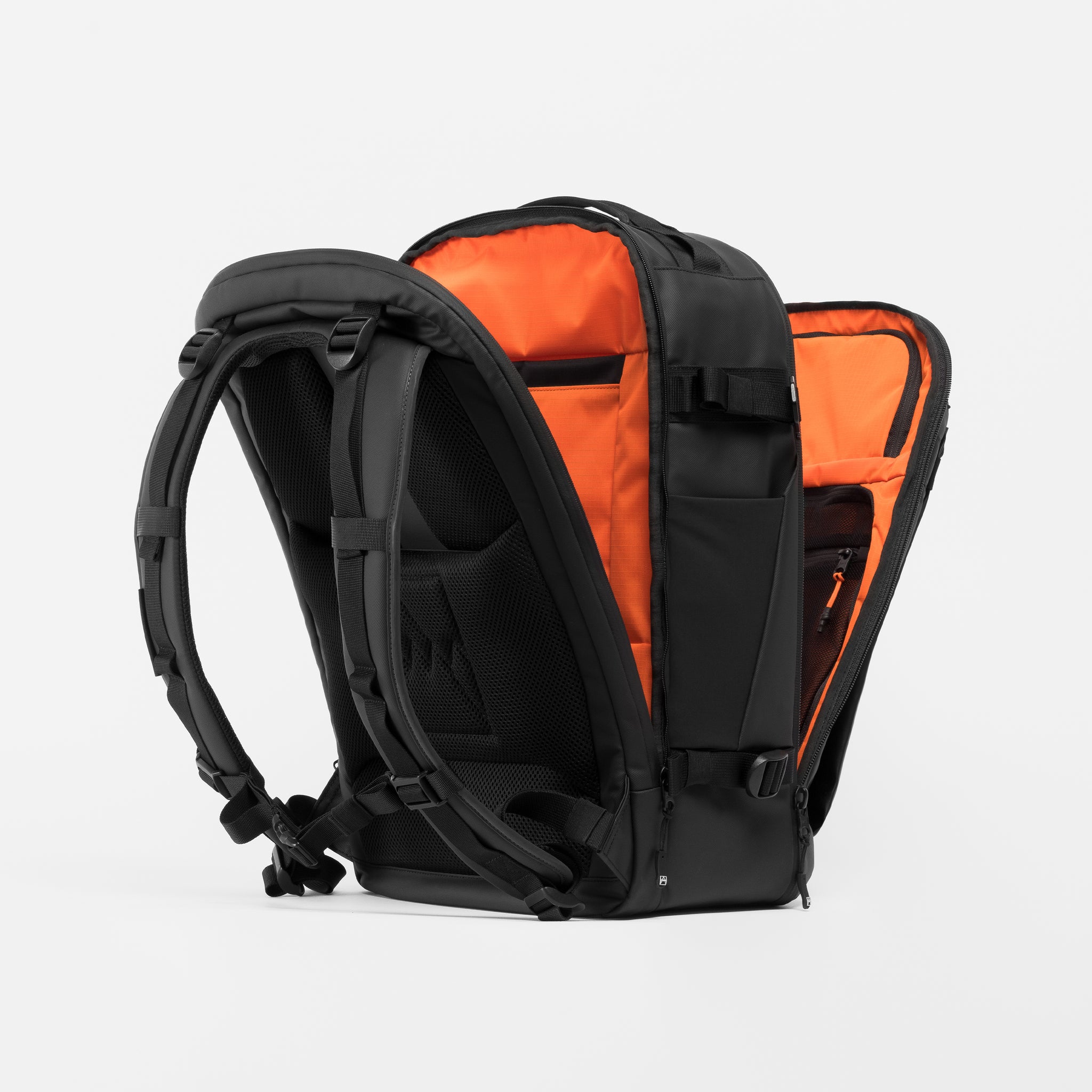 A studio shot of the clamshell opening on the Hybrid Backpack 30L in All Black