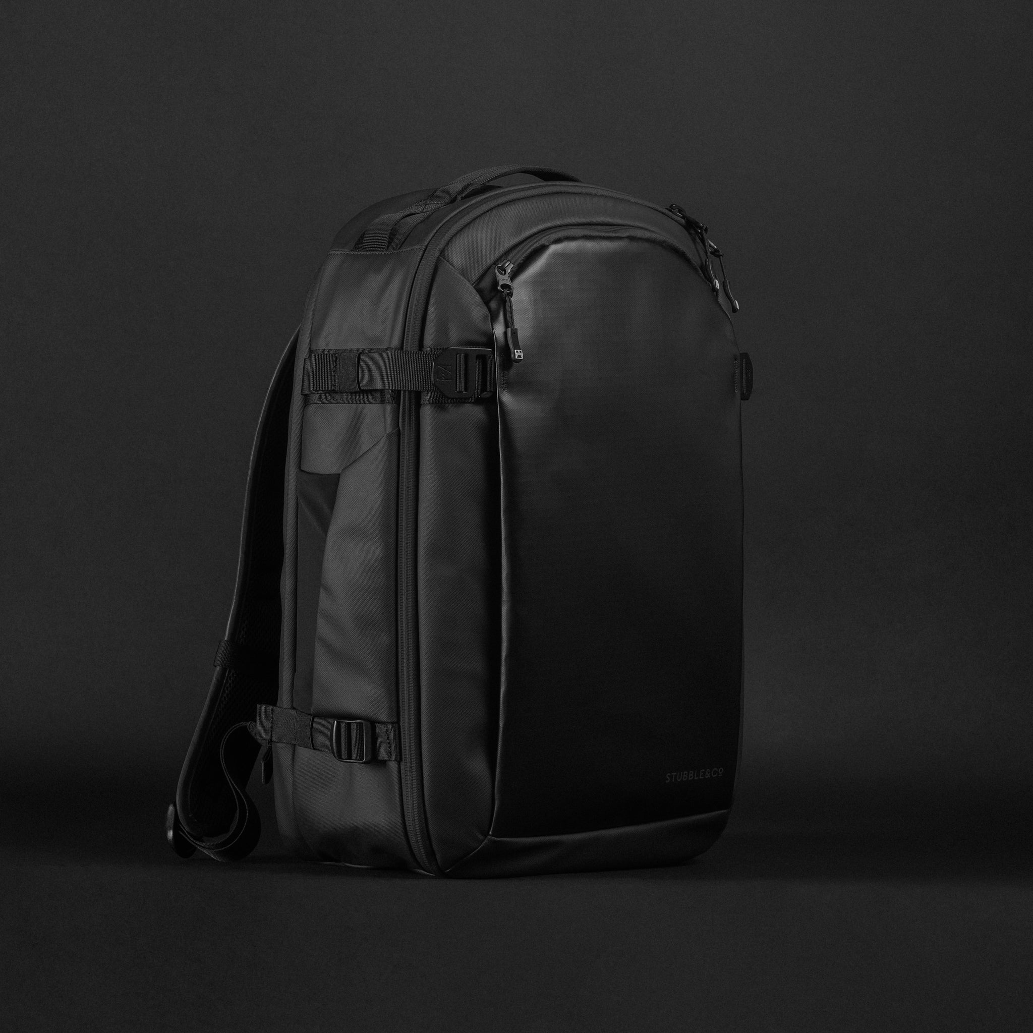 A studio shot of a black Hybrid Backpack 30L at an angle
