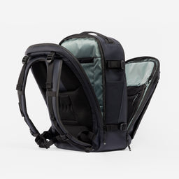 A studio shot of the clamshell opening on the Hybrid Backpack 30L in Midnight Blue