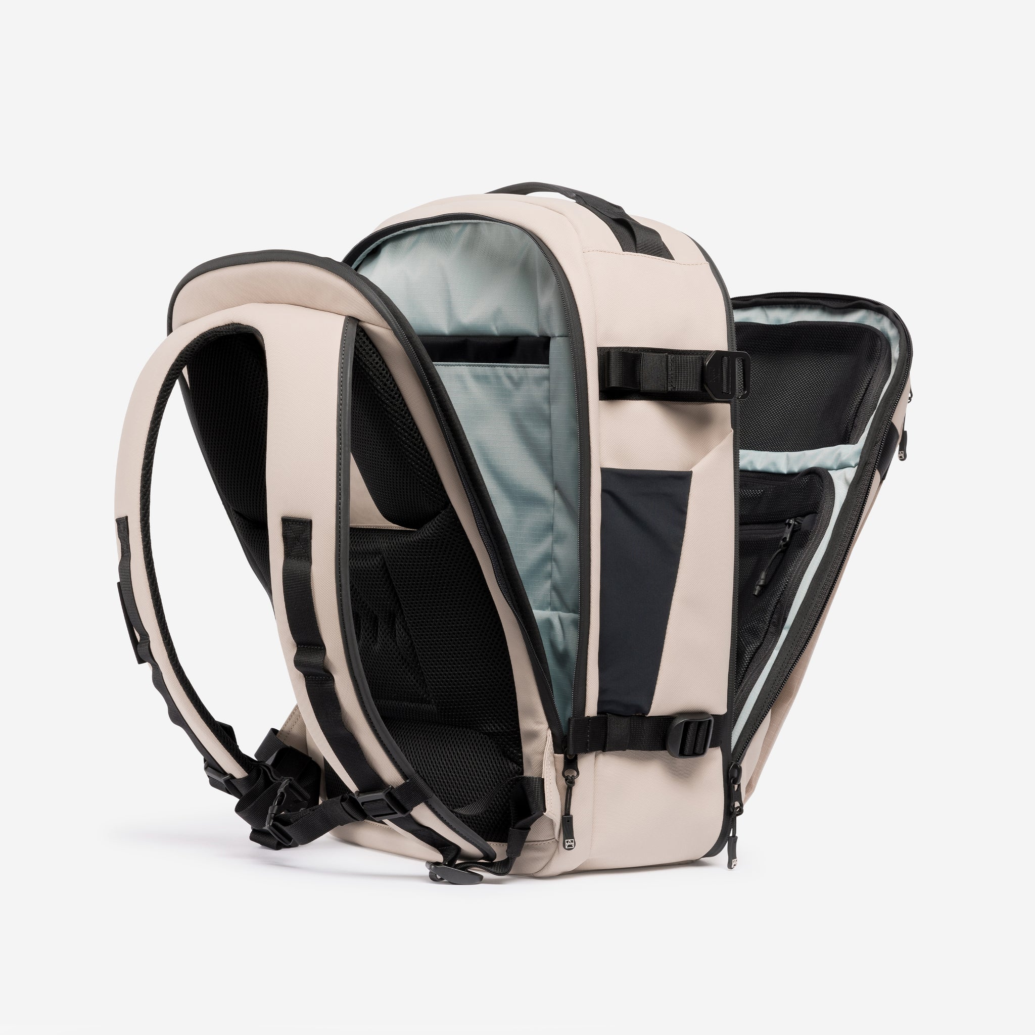 A studio shot of the clamshell opening on the Hybrid Backpack 30L in Sand