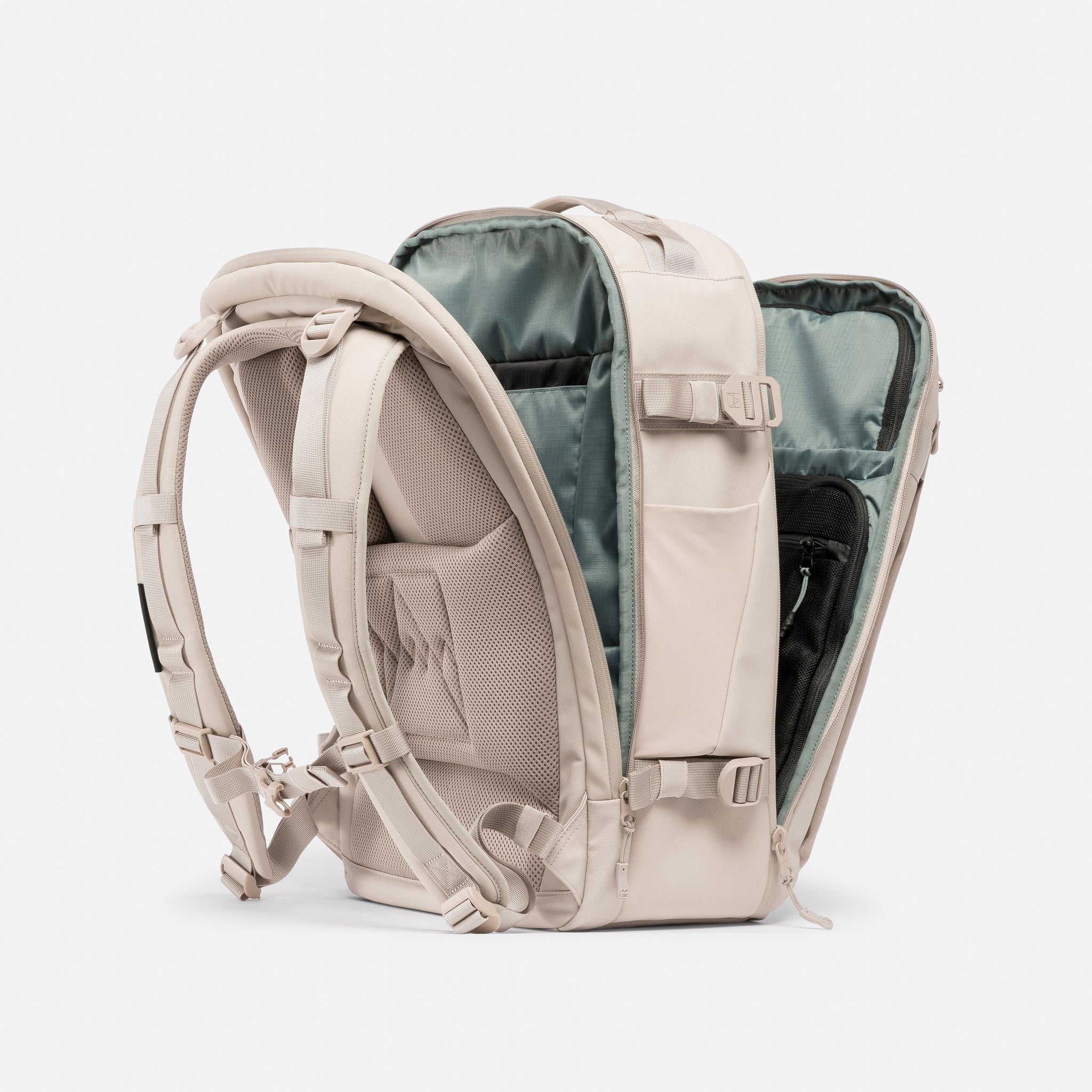 A studio shot of the clamshell opening on the Hybrid Backpack 30L in Tonal Sand