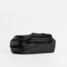 Kit Bag 30L in All Black resting horizontally against a plain white background. 