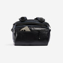 A studio shot of the easy access pocket on the kit Bag 30L in Midnight Blue