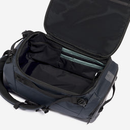 A studio shot of the interior compartment within the Kit Bag 30L in Midnight Blue