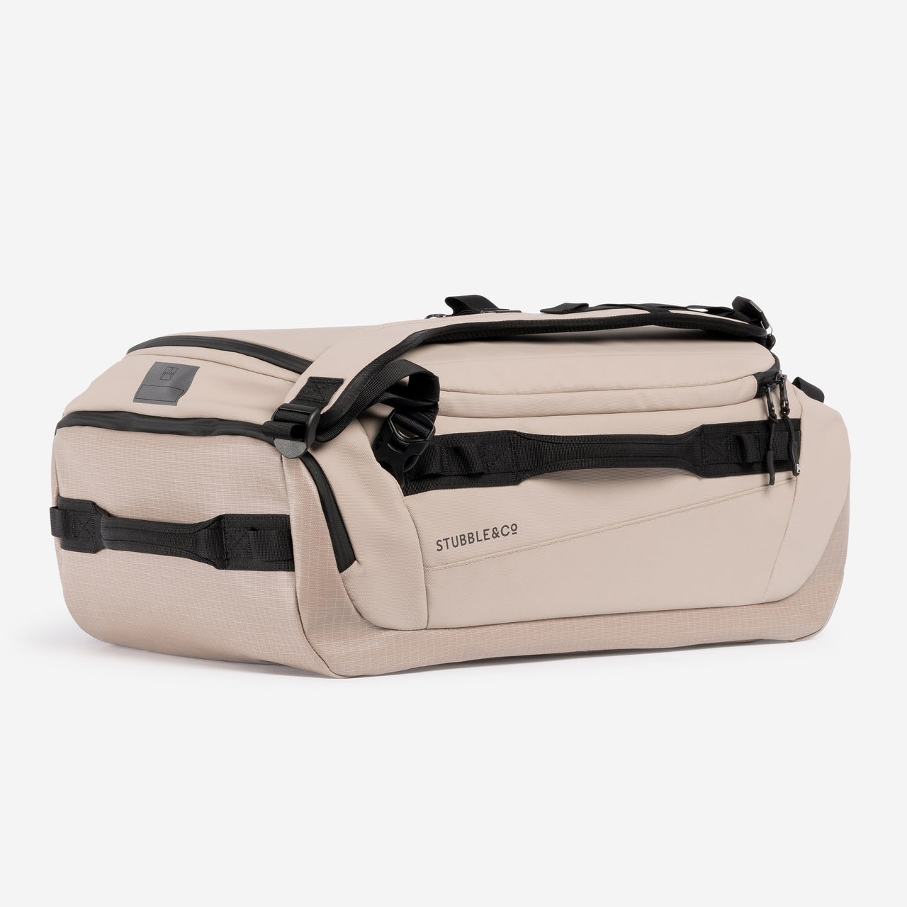 A studio shot of the end and side of the Kit Bag 30L in Sand
