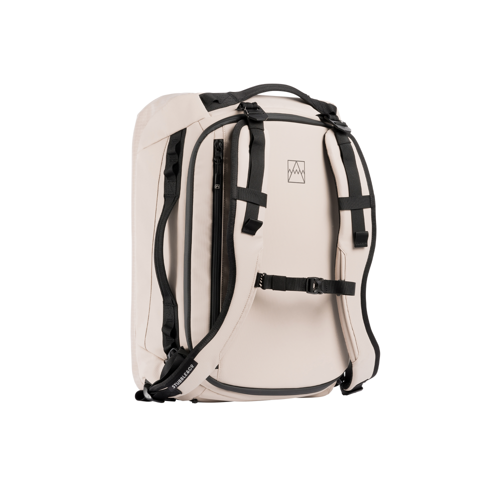 A studio shot of the front and side of a Kit bag 30l as cut out transparent PNG- sand