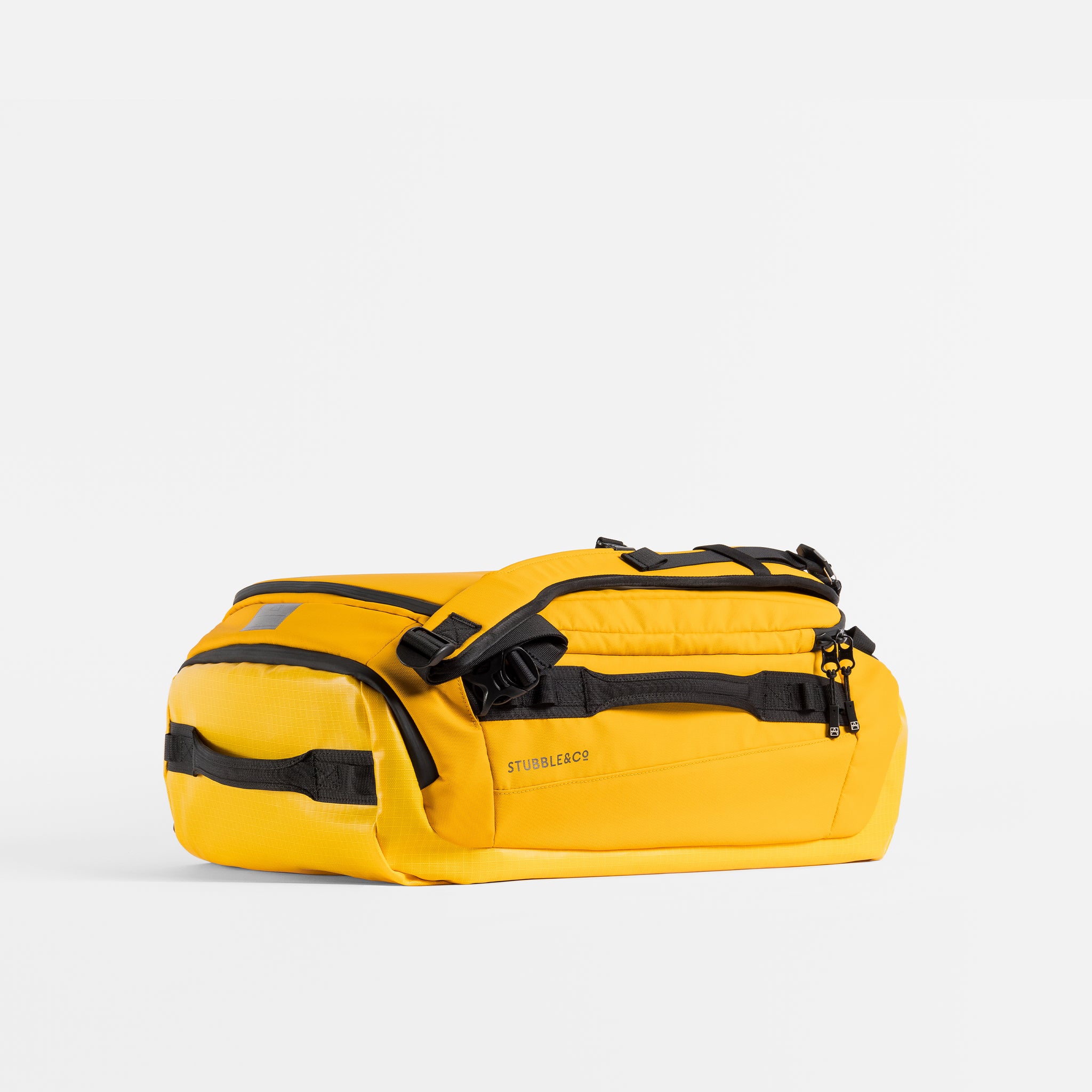 Kit Bag 30L in Yellow resting horizontally on a plain white background. 