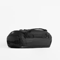 Kit Bag 40L in All Black resting horizontally against a plain white background. 