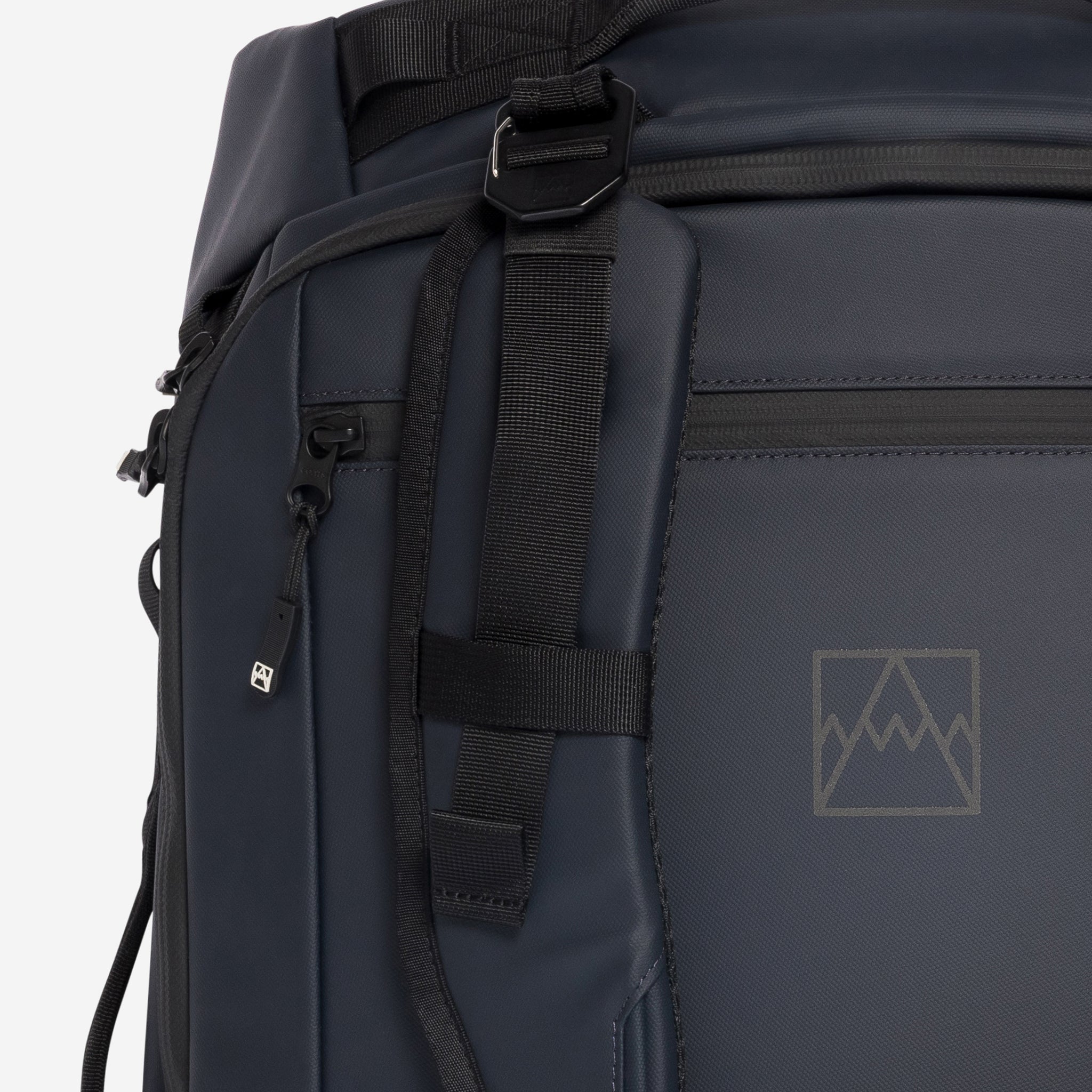 A close up of the adjustable and removable straps on the Kit Bag 40L in Midnight Blue