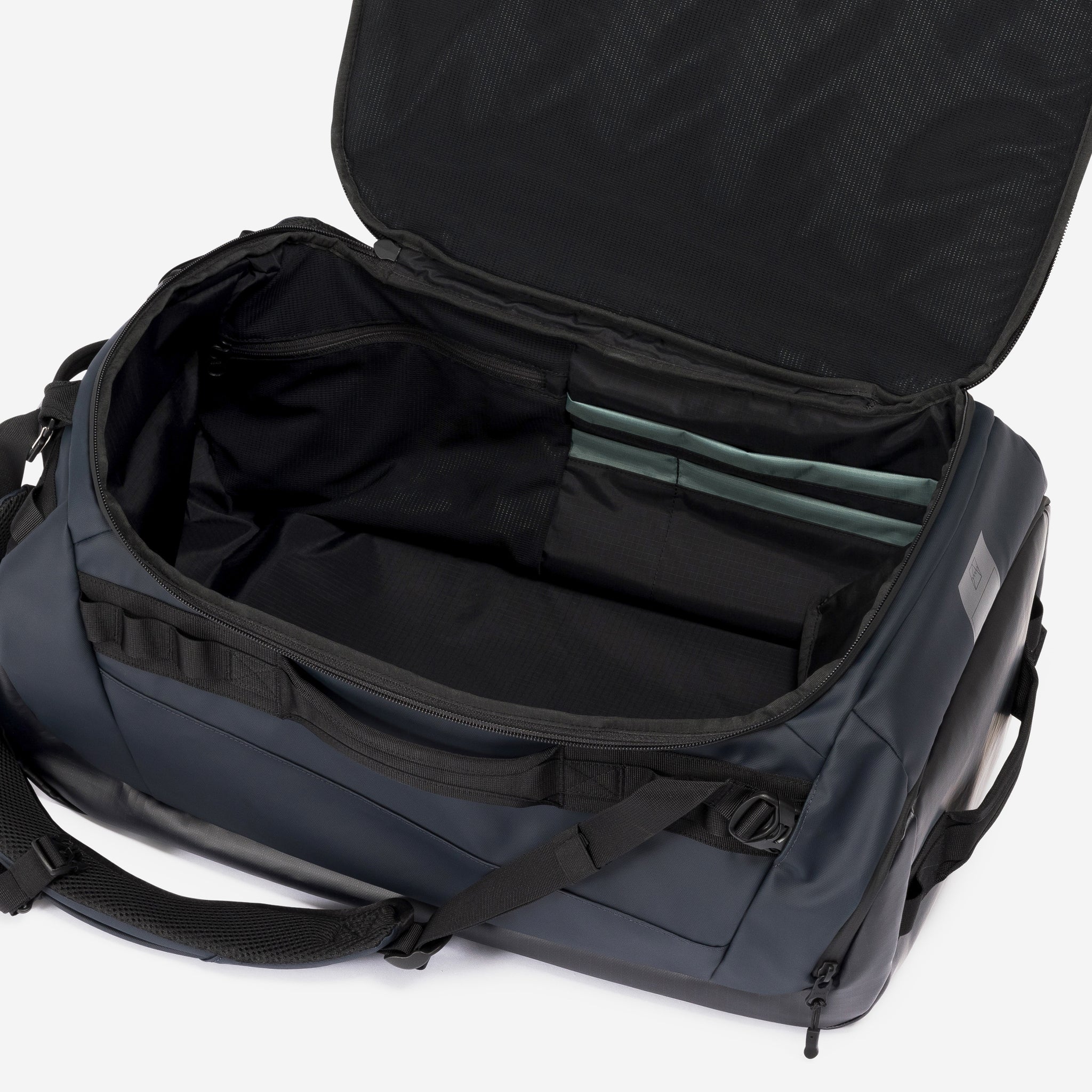A studio shot of the interior compartment on the Kit Bag 40L in Midnight Blue