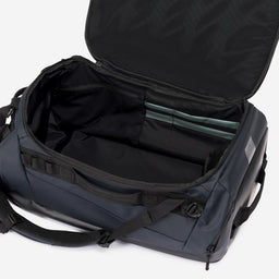 A studio shot of the interior compartment on the Kit Bag 40L in Midnight Blue