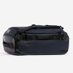 A studio shot of the side and end of the Kit Bag 40L in Midnight Blue